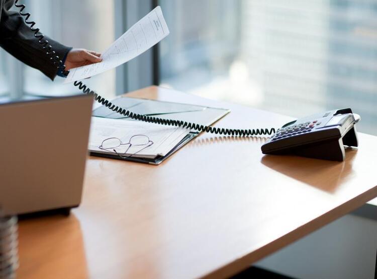 Desk with phone and laptop